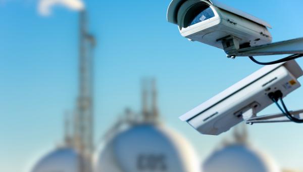security cameras in front of spherical storage tanks